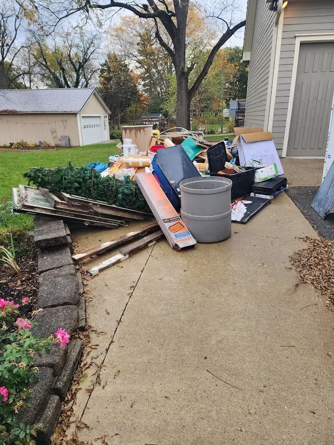 Dumpster being loaded with debris for 30 Yard Dumpster Rental in Taylor